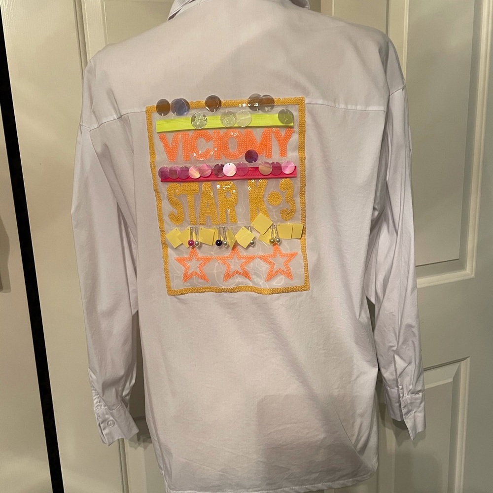 White long sleeve blouse with colorful back